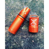 Exotac titanLIGHT Lighter orange on a rock
